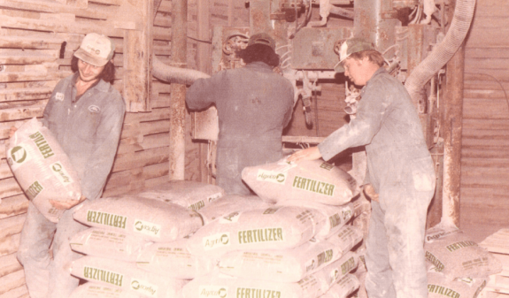 Holmes Agro employees with fertilizer